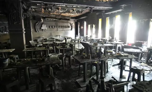 In this handout photo released by Bangkok Metropolitan Administration, the interior of a beer bar is seen after a fire in Bangkok, Thailand, Monday, July 13, 2026. (Bangkok Metropolitan Administration via AP)