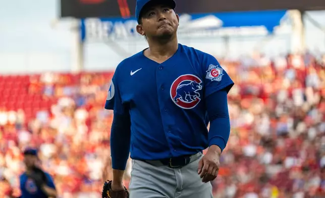 Chicago Cubs pitcher Shota Imanaga reacts after a strike out in the second inning of a baseball game against the Cincinnati Reds, Friday, July 10, 2026, in Cincinnati. (AP Photo/Michael Swensen)