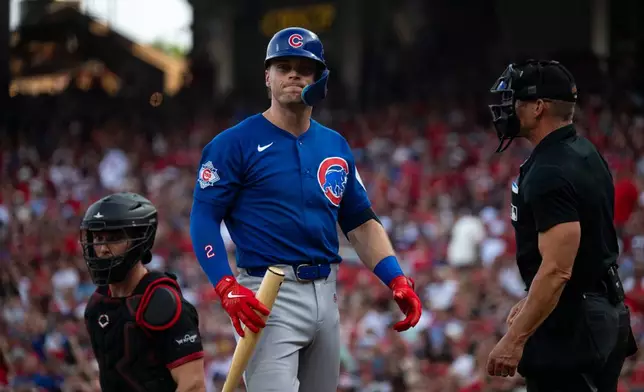 Chicago Cubs' Nico Hoerner reacts after striking out in the second inning of a baseball game against the Cincinnati Reds Friday, July 10, 2026 in Cincinnati. (AP Photo/Michael Swensen)