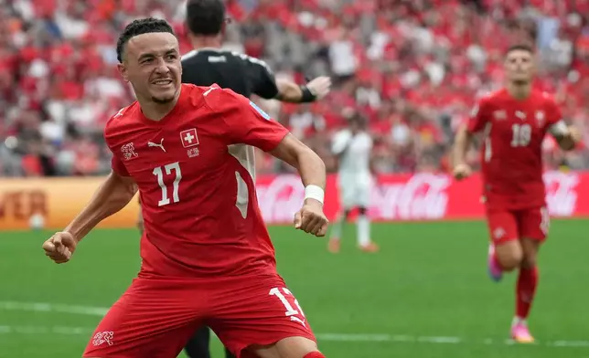 Switzerland's Ruben Vargas (17) celebrates after scoring during the World Cup Group B soccer match between Switzerland and Canada in Vancouver, British Columbia, Wednesday, June 24, 2026. (AP Photo/Abbie Parr)