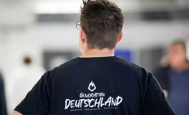 FILE - A party member is pictured during the re-founding of the AfD youth organization as "Generation Deutschland" in Giessen, Germany, Nov. 29, 2025. (AP Photo/Martin Meissner, File)
