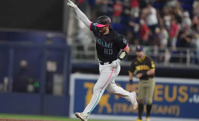 Miami Marlins' Joe Mack (80) gestures after hitting a home run during the second inning of a baseball game against the San Diego Padres Friday, July 24, 2026, in Miami. (AP Photo/Marta Lavandier)