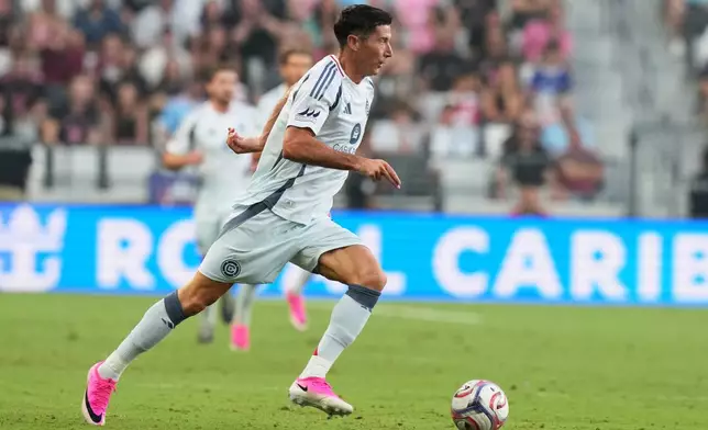 Chicago Fire forward Robert Lewandowski runs with the ball during the first half of an MLS soccer match against Inter Miami, Wednesday, July 22, 2026, in Miami. (AP Photo/Lynne Sladky)