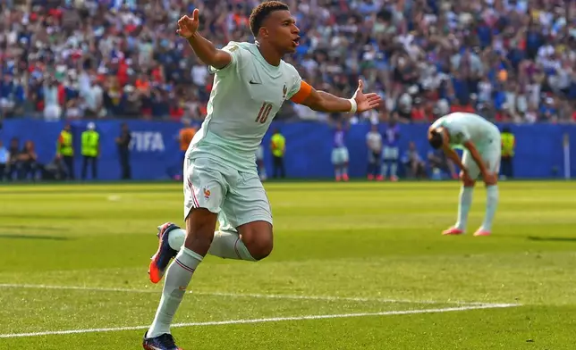 France's Kylian Mbappe (10) celebrates scoring the opening goal during the World Cup quarterfinal soccer match between France and Morocco in Foxborough, Mass., near Boston, Thursday, July 9, 2026. (AP Photo/Steven Senne)