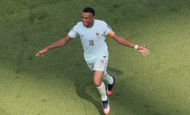 France's Kylian Mbappe (10) celebrates after teammate Ousmane Dembele scored their second goal during the World Cup quarterfinal soccer match against Morocco in Foxborough, Mass., near Boston, Thursday, July 9, 2026. (AP Photo/Mark Stockwell) CORRECTION: Corrects to team's second goal, not first and goal scorer to France's Ousmane Dembele, not Kylian Mbappe.