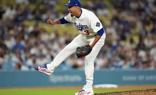 Los Angeles Dodgers relief pitcher Edwin Diaz (3) reacts while earning a save against the Seattle Mariners during the ninth inning of a baseball game Wednesday, July 29, 2026, in Los Angeles. (AP Photo/Scott Strazzante)