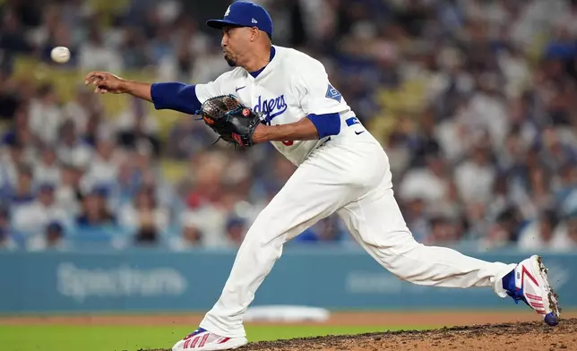 Los Angeles Dodgers relief pitcher Edwin Diaz (3) delivers the ball against the Seattle Mariners during the ninth inning of a baseball game Wednesday, July 29, 2026, in Los Angeles. (AP Photo/Scott Strazzante)