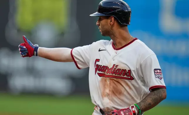 Cleveland Guardians' Brayan Rocchio gestures to the dugout after hitting a single in the fourth inning of a baseball game against the Chicago White Sox in Cleveland, Saturday, July 4, 2026. (AP Photo/Sue Ogrocki)