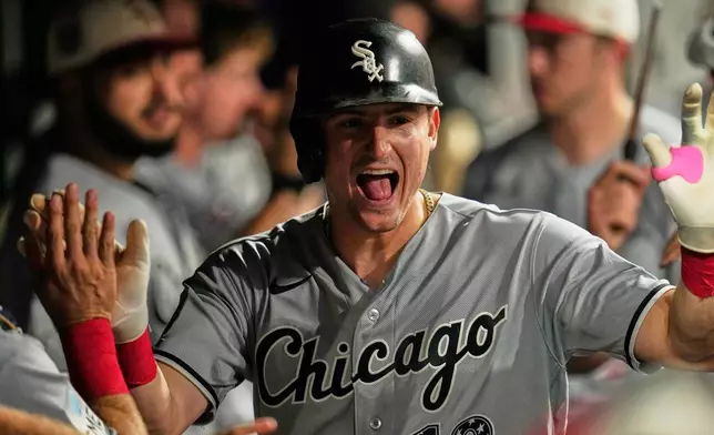 Chicago White Sox's Colson Montgomery celebreates in the duogut after hitting a home run in the eighth inning of a baseball game against the Cleveland Guardians in Cleveland, Saturday, July 4, 2026. (AP Photo/Sue Ogrocki)
