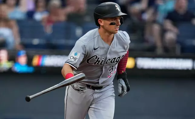 Chicago White Sox's Drew Romo tosses his bat as he heads to first base with a walk in the fourth inning of a baseball game against the Cleveland Guardians in Cleveland, Saturday, July 4, 2026. (AP Photo/Sue Ogrocki)