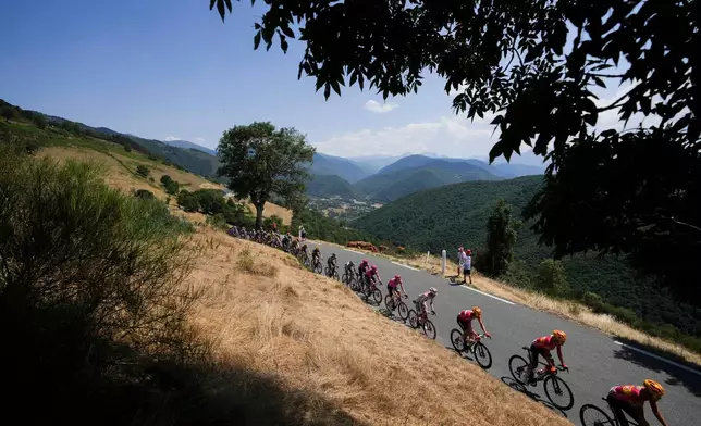 The pack rides during the sixth stage of the Tour de France cycling race over 201.5 kilometers (115.5 miles) with start in Pau and finish in Gavarnie-Gedre, France, Thursday, July 9, 2026. (AP Photo/Thibault Camus)