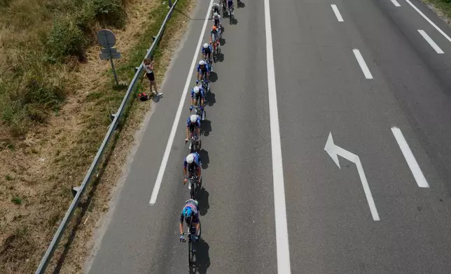 The pack rides during the seventh stage of the Tour de France cycling race over 175.1 kilometers (108.7 miles) with start in Hagetmau and finish in Bordeaux, France, Friday, July 10, 2026. (AP Photo/Mosa'ab Elshamy)