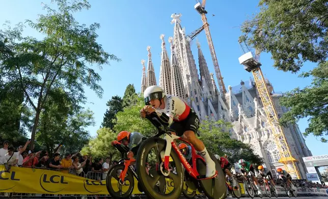 Netcompany Ineos Cycling Team compete during the first stage of the Tour de France cycling race, a team time-trial over 19.6 kilometers (11.8 miles) with start and finish in Barcelona, Spain, Saturday, July 4, 2026. (AP Photo/Mosa'ab Elshamy)