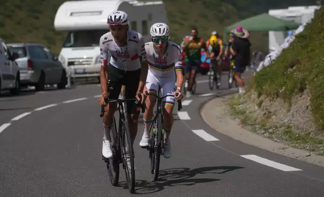 Mexico's Isaac Del Toro and Slovenia's Tadej Pogacar lead the race during the sixth stage of the Tour de France cycling race over 201.5 kilometers (115.5 miles) with start in Pau and finish in Gavarnie-Gedre, France, Thursday, July 9, 2026. (AP Photo/Thibault Camus)