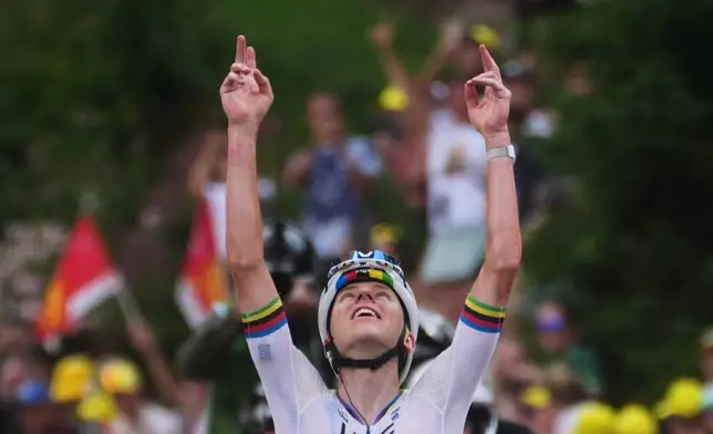 Slovenia's Tadej Pogacar celebrates as he crosses the finish line to win the sixth stage of the Tour de France cycling race with start in Pau and finish in Gavarnie-Gedre, France, Thursday, July 9, 2026. (AP Photo/Thibault Camus)