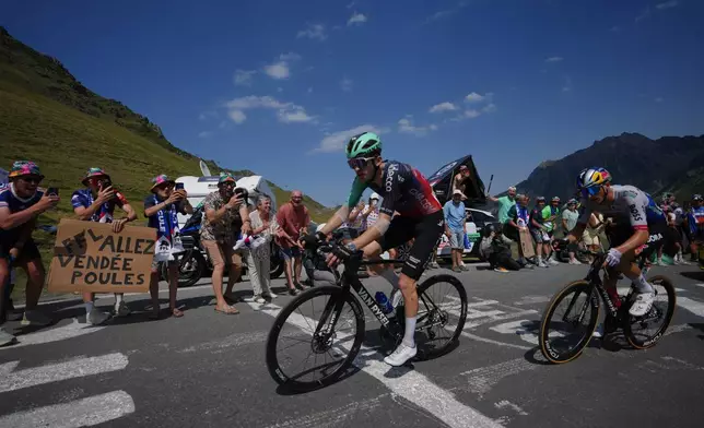 France's Paul Seixas, left, rides during the sixth stage of the Tour de France cycling race with start in Pau and finish in Gavarnie-Gedre, France, Thursday, July 9, 2026. (AP Photo/Mosa'ab Elshamy)