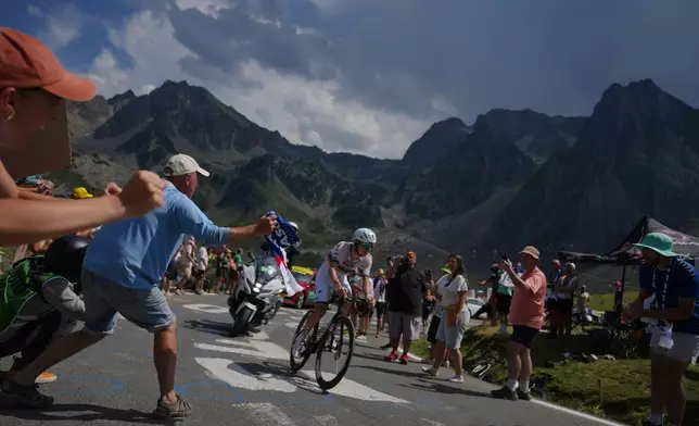 Spectators cheer Slovenia's Tadej Pogacar during the sixth stage of the Tour de France cycling race with start in Pau and finish in Gavarnie-Gedre, France, Thursday, July 9, 2026. (AP Photo/Thibault Camus)