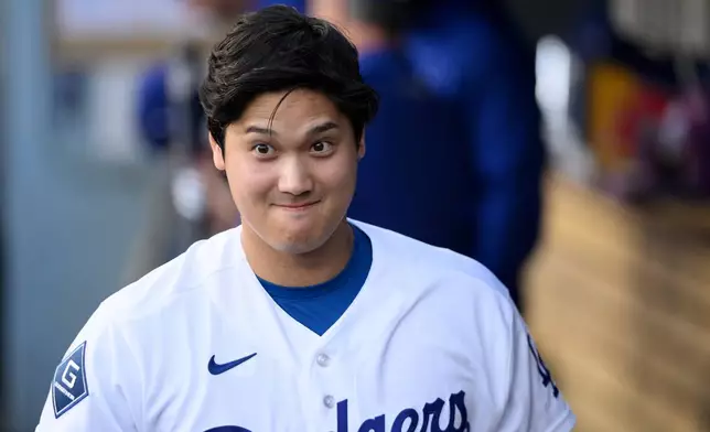 Los Angeles Dodgers' Shohei Ohtani reacts before a baseball game against the San Diego Padres in Los Angeles, Thursday, July 2, 2026. (AP Photo/Kyusung Gong)