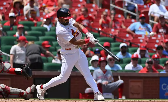 St. Louis Cardinals' José Fermín is hits a sacrifice fly to score Alec Burleson during the second inning of a baseball game against the Cincinnati Reds, Sunday, July 26, 2026, in St. Louis. (AP Photo/Jeff Le)