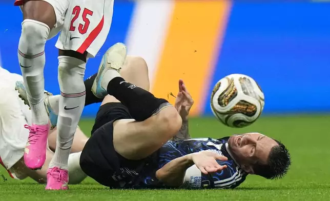 Argentina's Lionel Messi (10) falls during the World Cup semifinal soccer match between England and Argentina in Atlanta, Wednesday, July 15, 2026. (AP Photo/Stephanie Scarbrough)