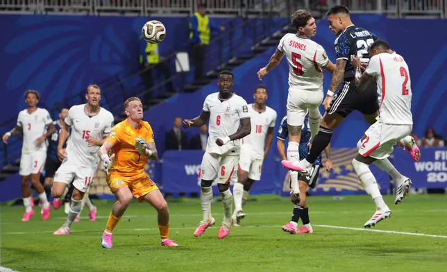 Argentina's Lautaro Martinez (22) heads the ball to score his side's second goal during the World Cup semifinal soccer match between England and Argentina in Atlanta, Wednesday, July 15, 2026. (AP Photo/Jacob Kupferman)