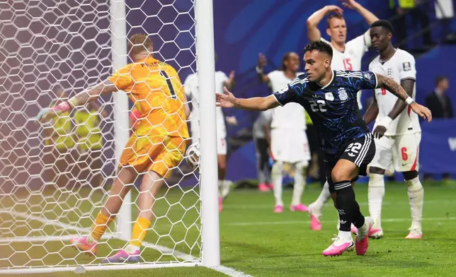 Argentina's Lautaro Martinez (22) celebrates after scoring his side's second goal during the World Cup semifinal soccer match between England and Argentina in Atlanta, Wednesday, July 15, 2026. (AP Photo/Jacob Kupferman)