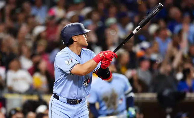 Toronto Blue Jays' Kazuma Okamoto watches his three-run home run against the Toronto Blue Jays in the fifth inning of a baseball game Friday, July 10, 2026, in San Diego. (AP Photo/Derrick Tuskan)