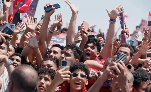 Feds crowd to greet the Egyptian national soccer team during their arrival at El-Alamein airport, 160 km (99 miles) west of Alexandria, Egypt, Friday, July 10, 2026. (AP Photo)