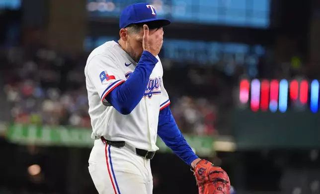 Texas Rangers starting pitcher Nathan Eovaldi comes off the field after the fifth inning of a baseball game against the Detroit Tigers, Thursday, July 2, 2026, in Arlington, Texas. (AP Photo/LM Otero)