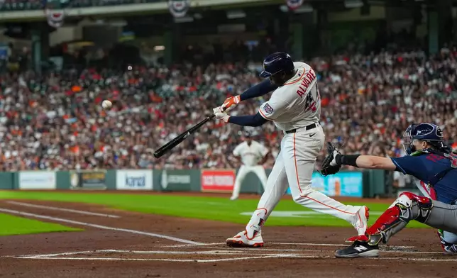 Houston Astros' Yordan Alvarez hits a home run during the first inning of a baseball game against the Tampa Bay Rays in Houston, Saturday, July 4, 2026. (AP Photo/Jon Shapley)