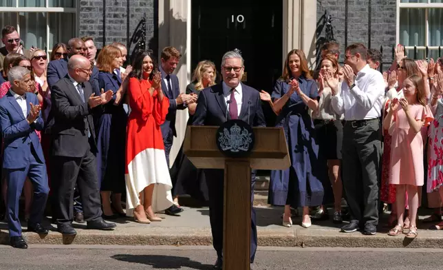 Britain's outgoing Prime Minister Keir Starmer receives applause as he leaves 10 Downing Street in London, Monday, July 20, 2026.(AP Photo/Kirsty Wigglesworth)