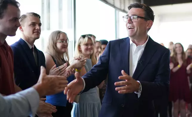Newly confirmed Labour Party leader Andy Burnham speaks with local stakeholders and party supporters during a visit to Gravesend Town Pier, Gravesend , England, Friday July 17, 2026. (Gareth Fuller/PA via AP)