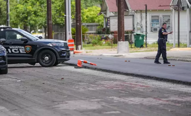 Police work on Canal Street in Houston, Tuesday, July 7, 2026, after a shooting. (Jacob Lujan/Houston Chronicle via AP)