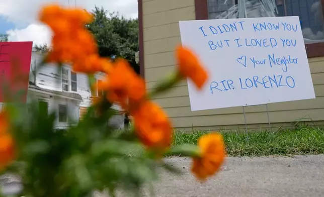 A makeshift memorial for Lorenzo Salgado Araujo, who was shot and killed by an ICE officer Tuesday, is shown Wednesday, July 8, 2026, in Houston. (AP Photo/David J. Phillip)