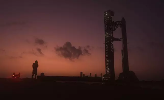 SpaceX's mega rocket Starship is prepared for a test flight in Starbase, Texas, Friday, July 24, 2026. (AP Photo/Eric Gay)
