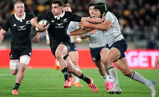 New Zealand's Josh Moorby fends off a defender during the Nations Championship rugby international between the All Blacks and Italy in Wellington, New Zealand, Saturday, July 11, 2026. (Marty Melville/Photosport via AP)