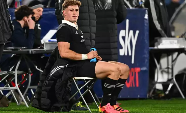 New Zealand's Ruben Love sits on the sideline after he was given yellow card that was rescinded during the Nations Championship rugby international between the All Blacks and Italy in Wellington, New Zealand, Saturday, July 11, 2026. (Marty Melville/Photosport via AP)