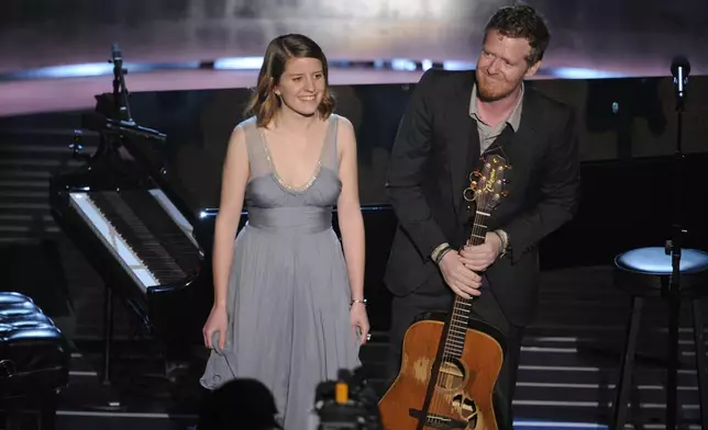 FILE - Marketa Irglova, left, and Glen Hansard appear after performing during the 80th Academy Awards in Los Angeles on Feb. 24, 2008. (AP Photo/Mark J. Terrill, File)