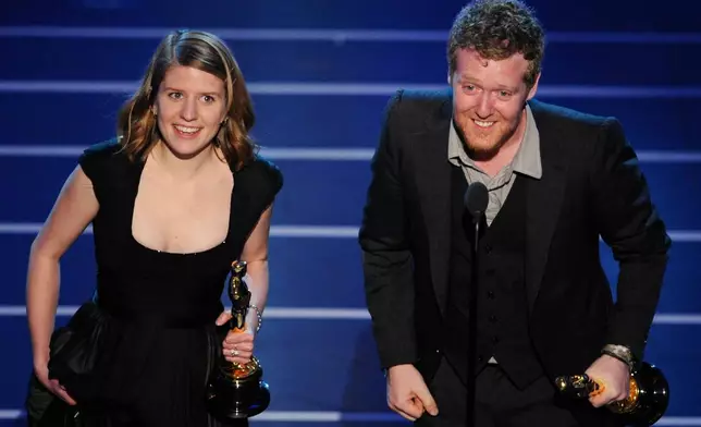 FILE - Marketa Irglova, left, and Glen Hansard accept the Oscar for best original song for "Falling Slowly" from the motion picture "Once" at the 80th Academy Awards in Los Angeles on Feb. 24, 2008. (AP Photo/Mark J. Terrill, File)