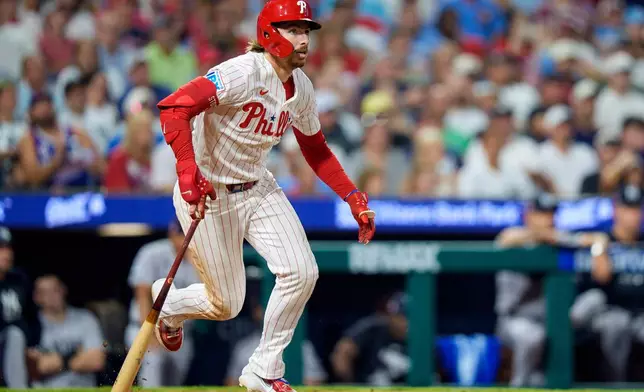 Philadelphia Phillies' Bryson Stott watches his three-run double during the sixth inning of a baseball game against the New York Yankees, Sunday, July 26, 2026, in Philadelphia. (AP Photo/Chris Szagola)