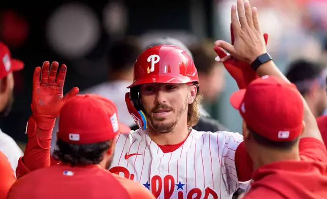 Philadelphia Phillies' Bryson Stott celebrates with teammates after his home run during the second inning of a baseball game against the New York Yankees, Sunday, July 26, 2026, in Philadelphia. (AP Photo/Chris Szagola)