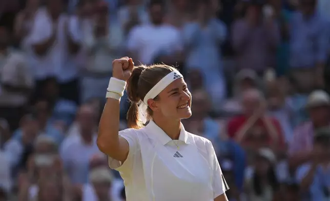 Karolina Muchova of Czech Republic celebrates her victory against Naomi Osaka of Japan in their quarter-final women's singles match at the Wimbledon Tennis Championships in London, Tuesday, July 7, 2026. (AP Photo/Kin Cheung)