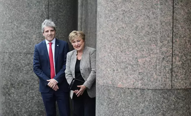 President of the International Monetary Fund Kristalina Georgieva, right, and Argentina Economy Minister Luis Caputo arrive at the Economy Ministry for a meeting in Buenos Aires, Argentina, Monday, July 27, 2026. (AP Photo/Gustavo Garello)