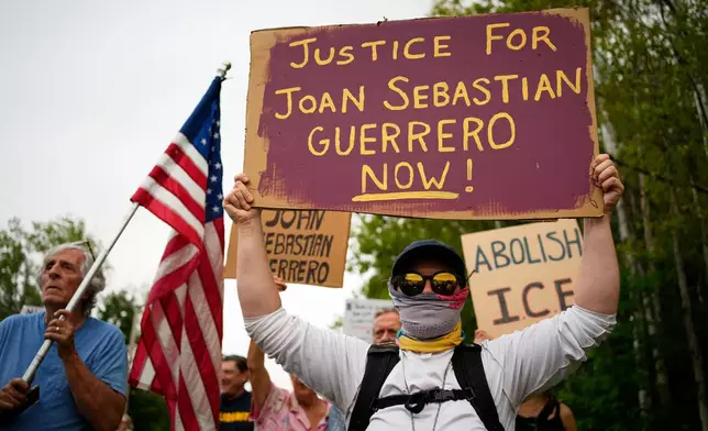 Protesters gather near a U.S. Immigration and Customs Enforcement facility Scarborough, Maine, one day after the shooting of Johan Sebastián Durán Guerrero, Tuesday, July 14, 2026. (AP Photo/Robert F. Bukaty) CORRECTION: Corrects ID to Johan Sebastián Durán Guerrero NOT Joan Sebastian Guerrero.