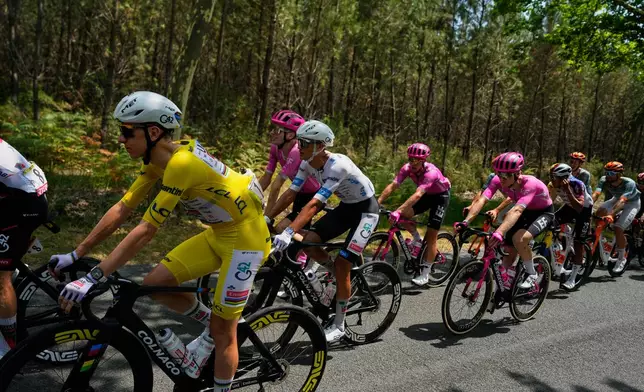 Slovenia's Tadej Pogacar, wearing the overall leader's yellow jersey, rides with the pack during the seventh stage of the Tour de France cycling race over 175.1 kilometers (108.7 miles) with start in Hagetmau and finish in Bordeaux, France, Friday, July 10, 2026. (AP Photo/Mosa'ab Elshamy)