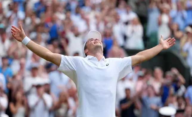 Arthur Fery of Britain celebrates winning the men's singles fourth round match against Grigor Dimitrov of Bulgaria at the Wimbledon Tennis Championships in London, Monday, July 6, 2026.(AP Photo/Kirsty Wigglesworth)