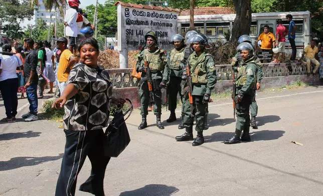 Security personnel stand guard outside a prison where deadly clashes broke out on Sunday, in Negombo, 35 kilometers (22 miles) north of the capital Colombo, Sri Lanka, Monday, July 6, 2026. (AP Photo)
