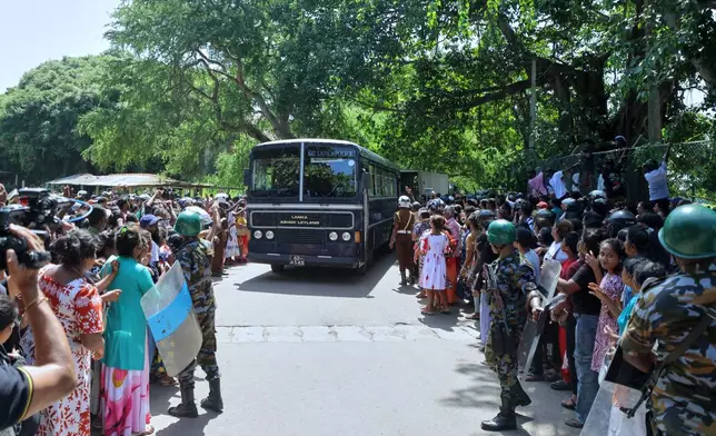A crowd of people wait outside a prison where deadly clashes broke out on Sunday, in Negombo, 35 kilometers (22 miles) north of the capital Colombo, Sri Lanka, Monday, July 6, 2026. (AP Photo)