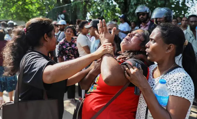 A relative of an inmate breaks down outside a prison where deadly clashes broke out on Sunday, in Negombo, 35 kilometers (22 miles) north of the capital Colombo, Sri Lanka, Monday, July 6, 2026. (AP Photo)