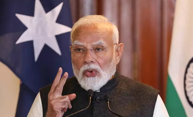 Indian Prime Minister Narendra Modi gestures as he speaks during a joint press conference with Australian Prime Minister Anthony Albanese in Melbourne, Australia, Thursday, July 9, 2026. (AP Photo/Hamish Blair)